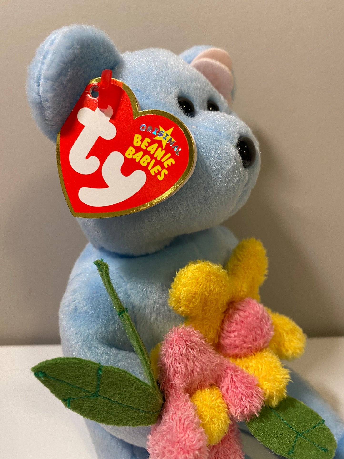 Ty Beanie Baby “Bluebonnet” the Blue Bear Holding Flowers (8.5 inch)