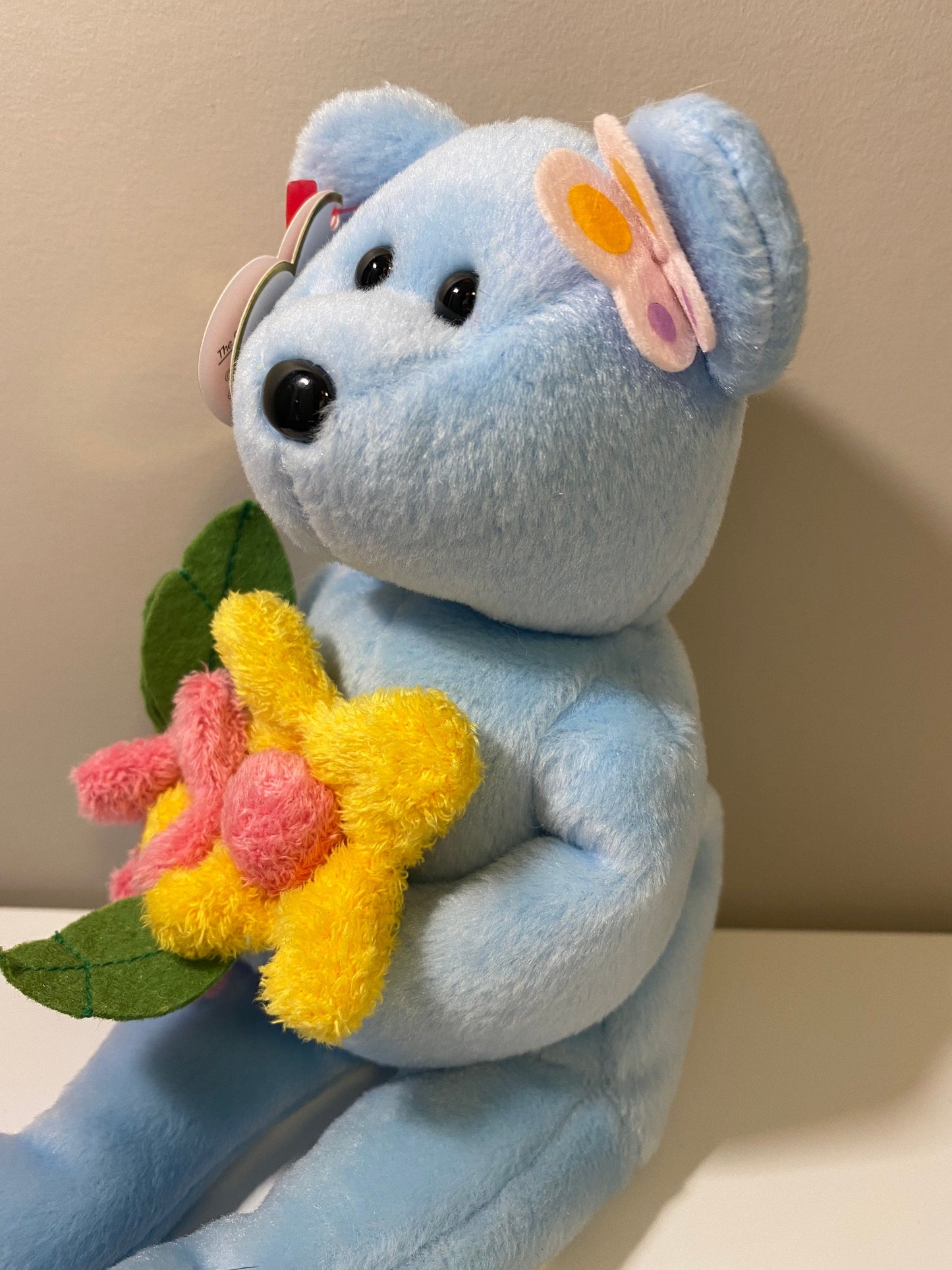 Ty Beanie Baby “Bluebonnet” the Blue Bear Holding Flowers (8.5 inch)