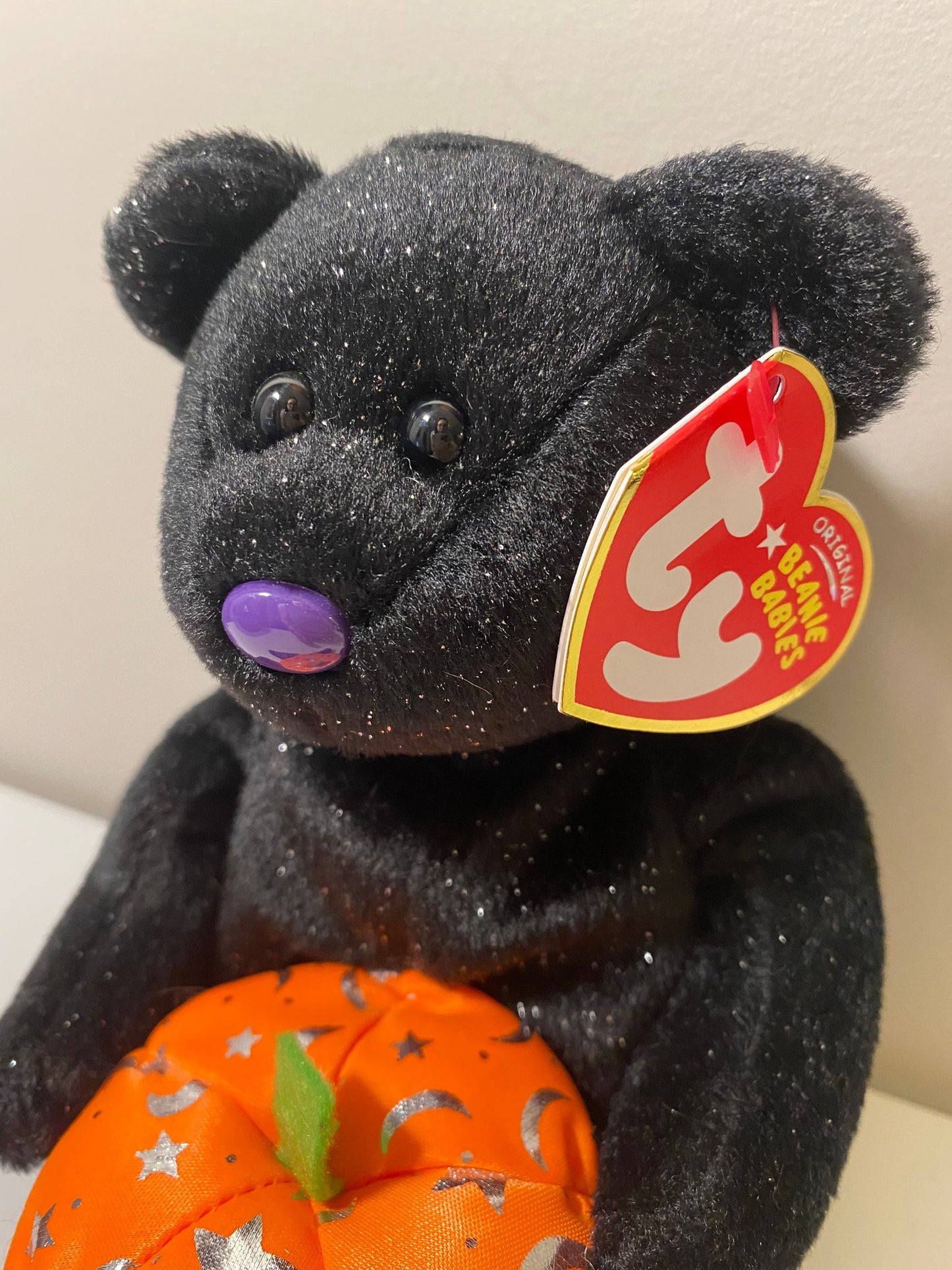 Ty Beanie Baby “Haunting” the Black Halloween Bear Holding a Pumpkin (8.5 inch)