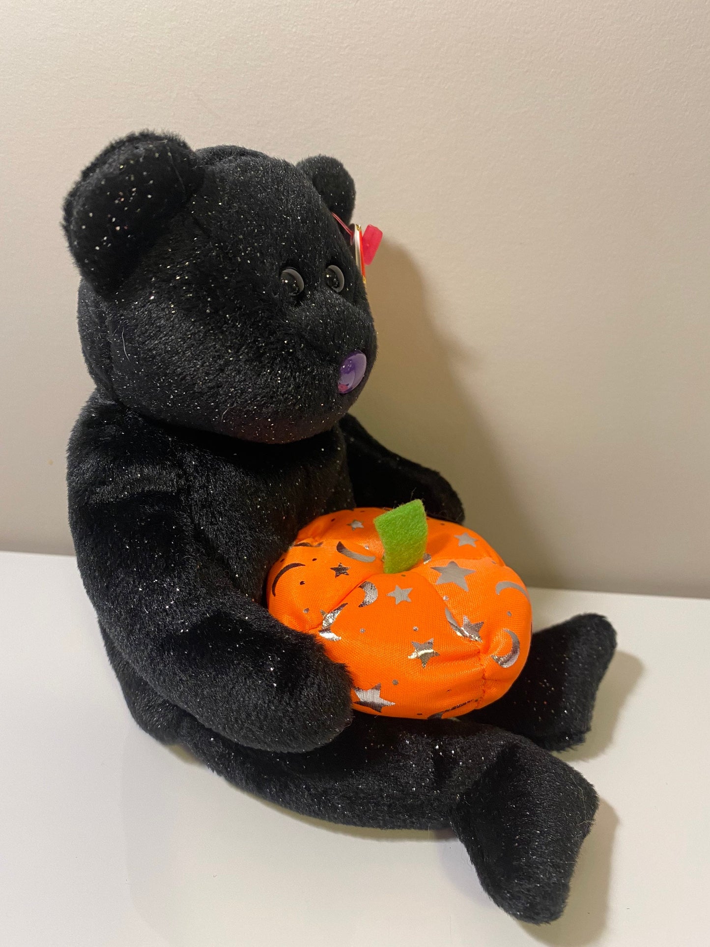 Ty Beanie Baby “Haunting” the Black Halloween Bear Holding a Pumpkin (8.5 inch)