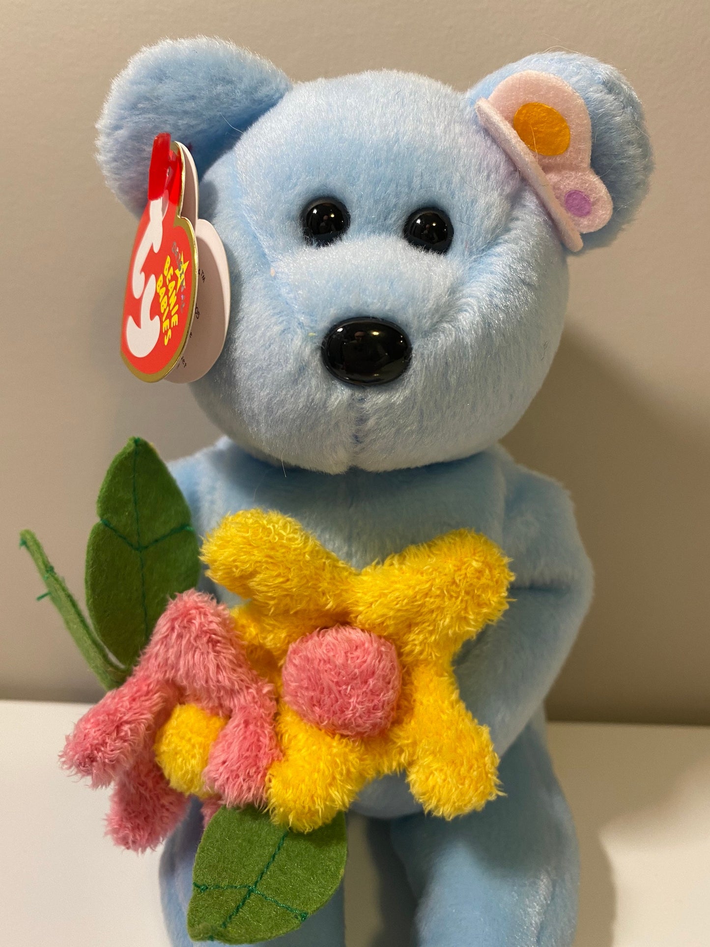 Ty Beanie Baby “Bluebonnet” the Blue Bear Holding Flowers (8.5 inch)