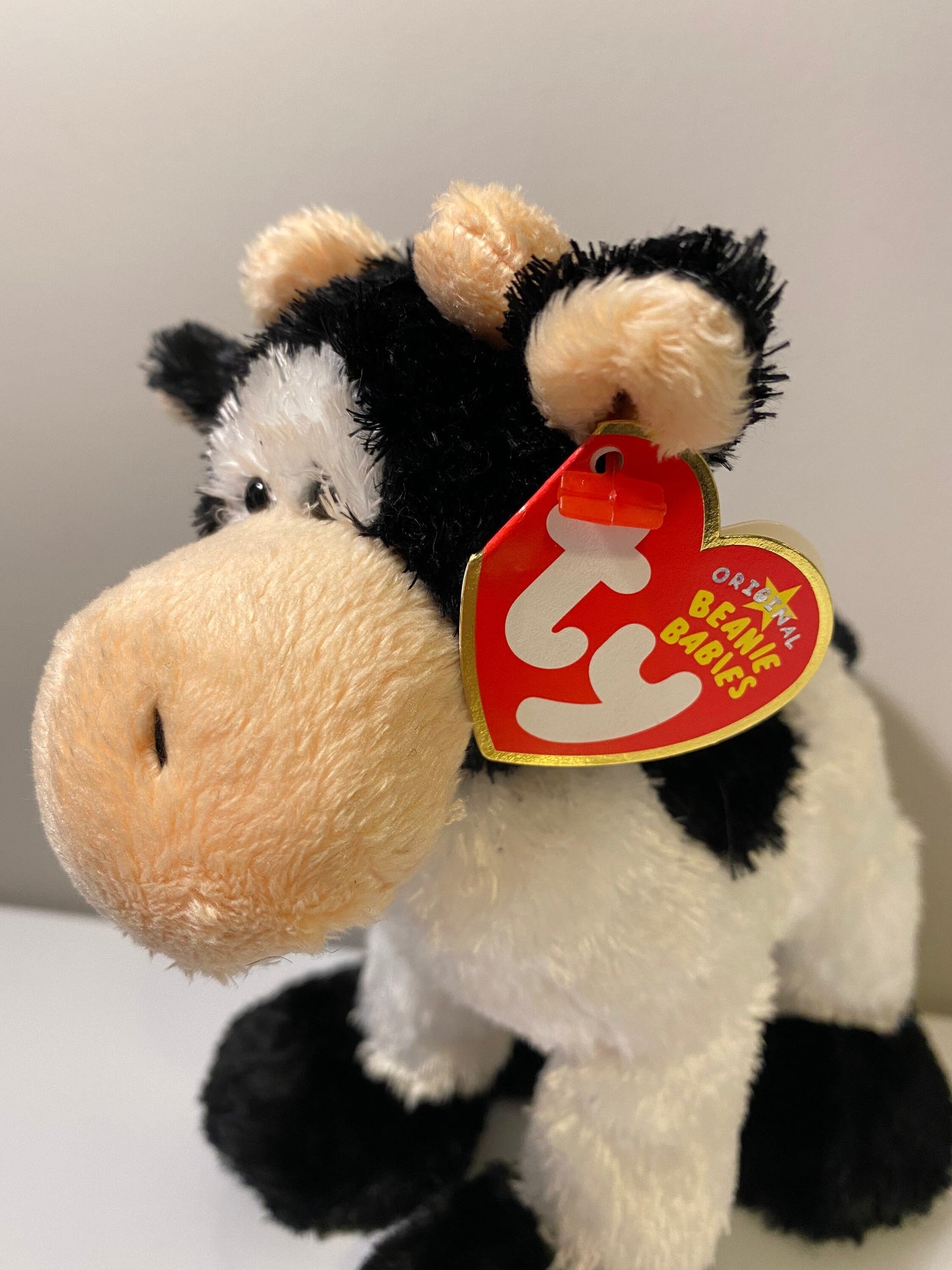 Ty Beanie Baby “Mooosly” the Cow ! (7 inch)