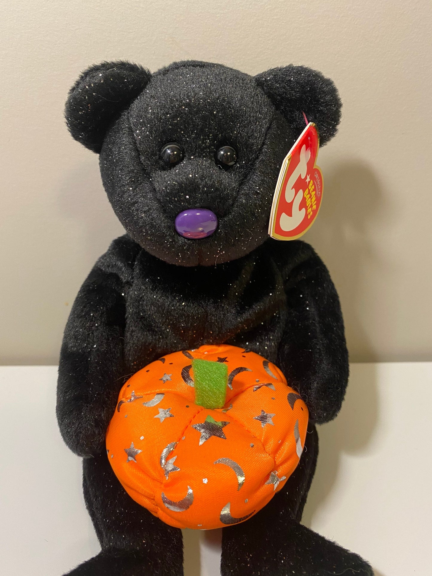 Ty Beanie Baby “Haunting” the Black Halloween Bear Holding a Pumpkin (8.5 inch)