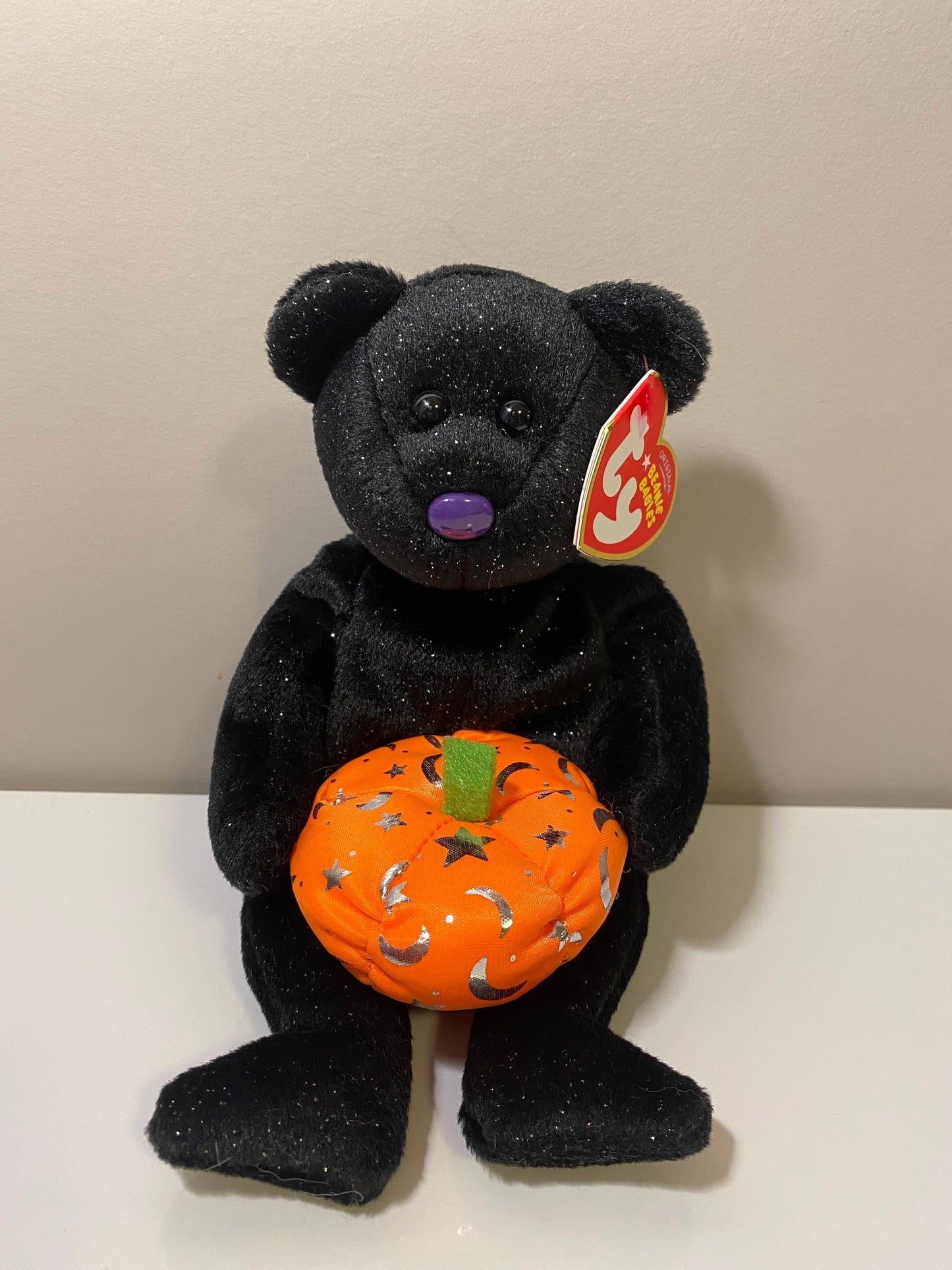 Ty Beanie Baby “Haunting” the Black Halloween Bear Holding a Pumpkin (8.5 inch)