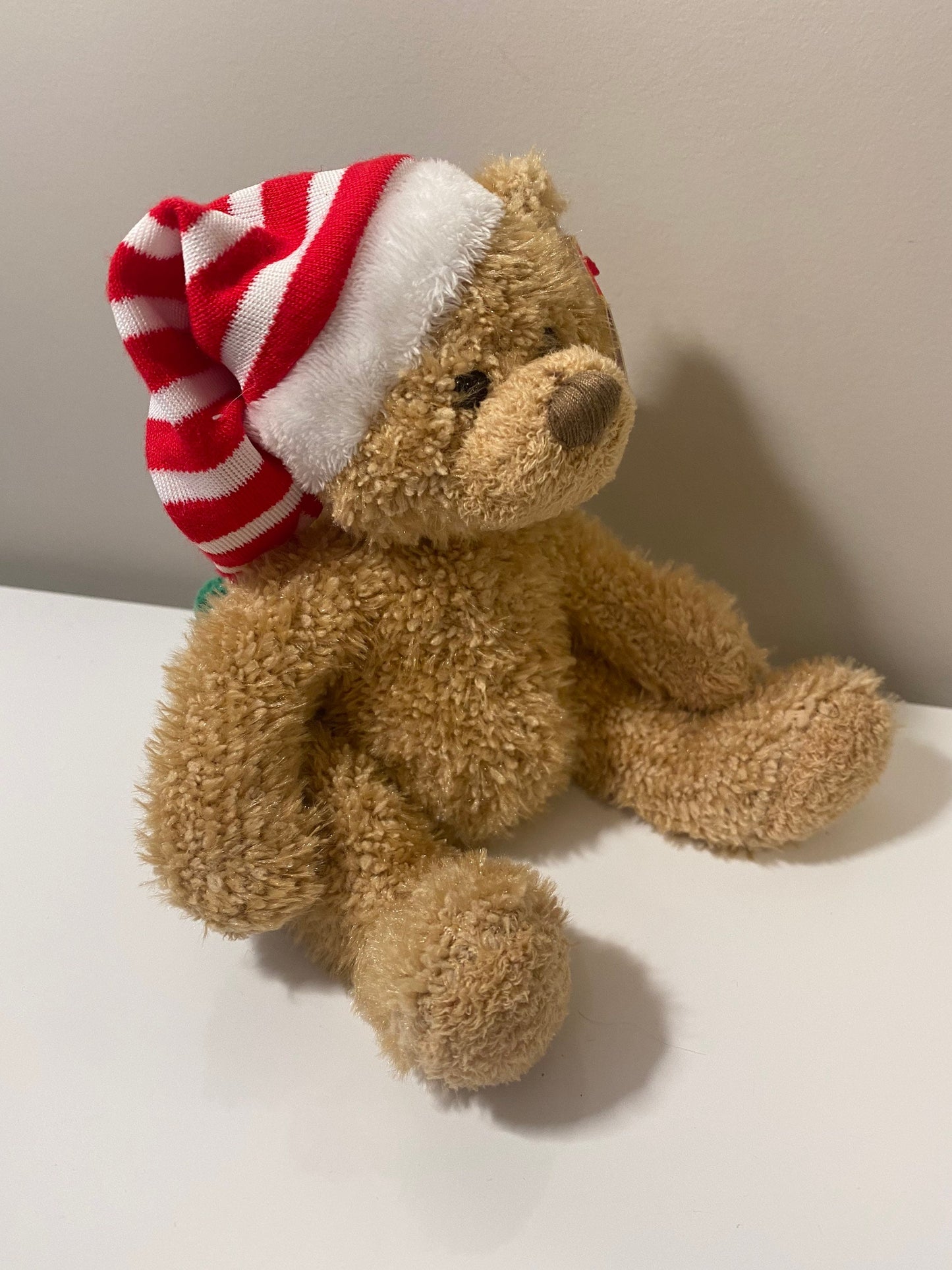 Ty Beanie Baby “Skis” the Holiday Bear wearing red and white striped hat (5.5 inch)