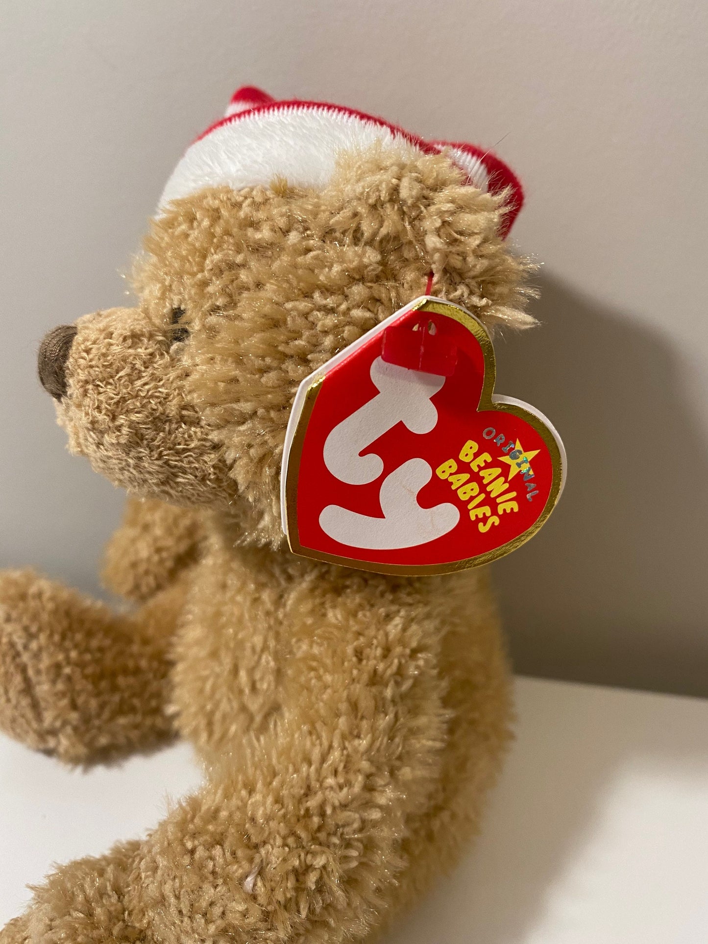 Ty Beanie Baby “Skis” the Holiday Bear wearing red and white striped hat (5.5 inch)