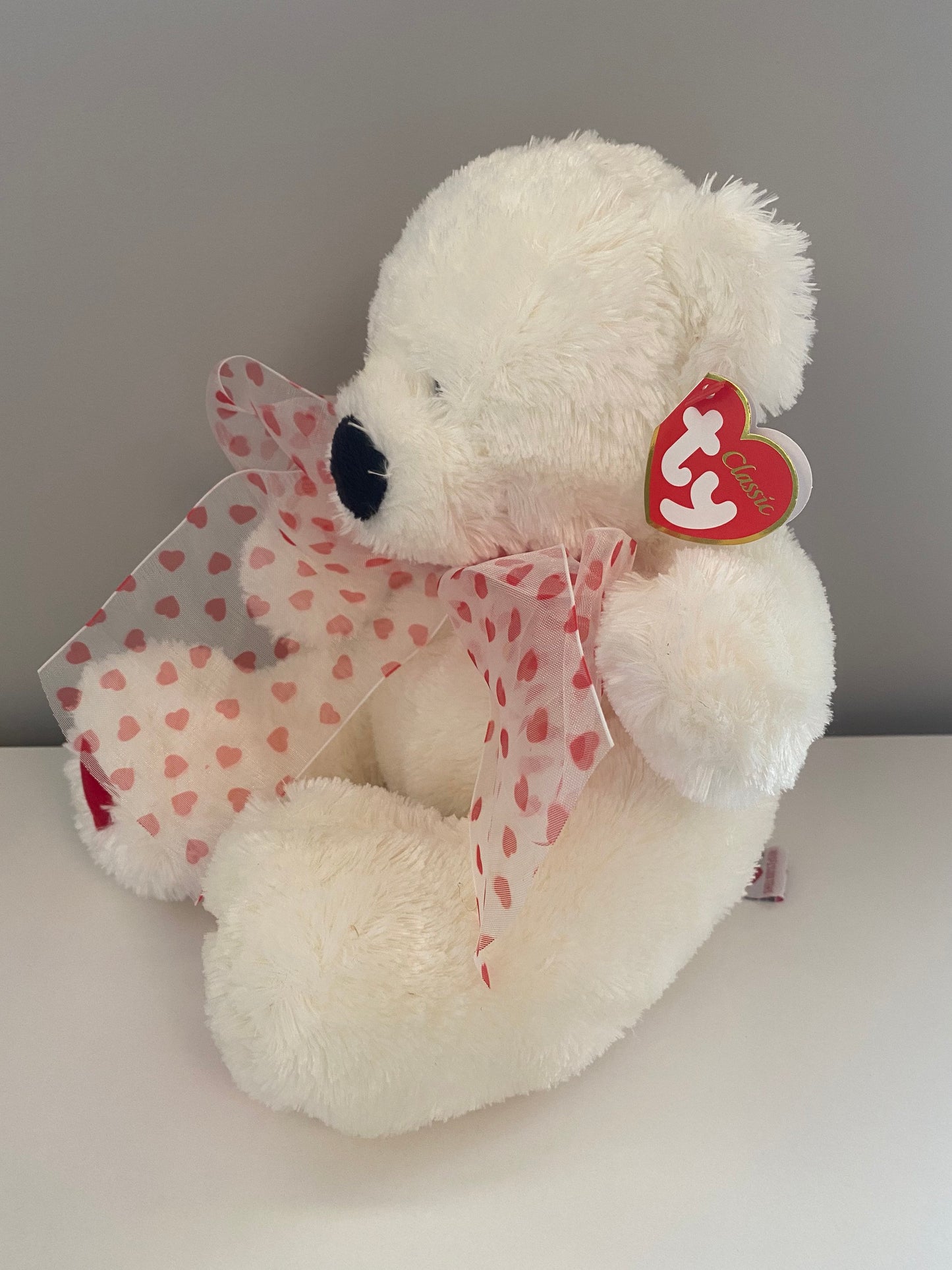 Ty Classics Collection “Caressa” the Bear  with Hearts on Feet and  Ribbon Bow around Neck (11 inch)