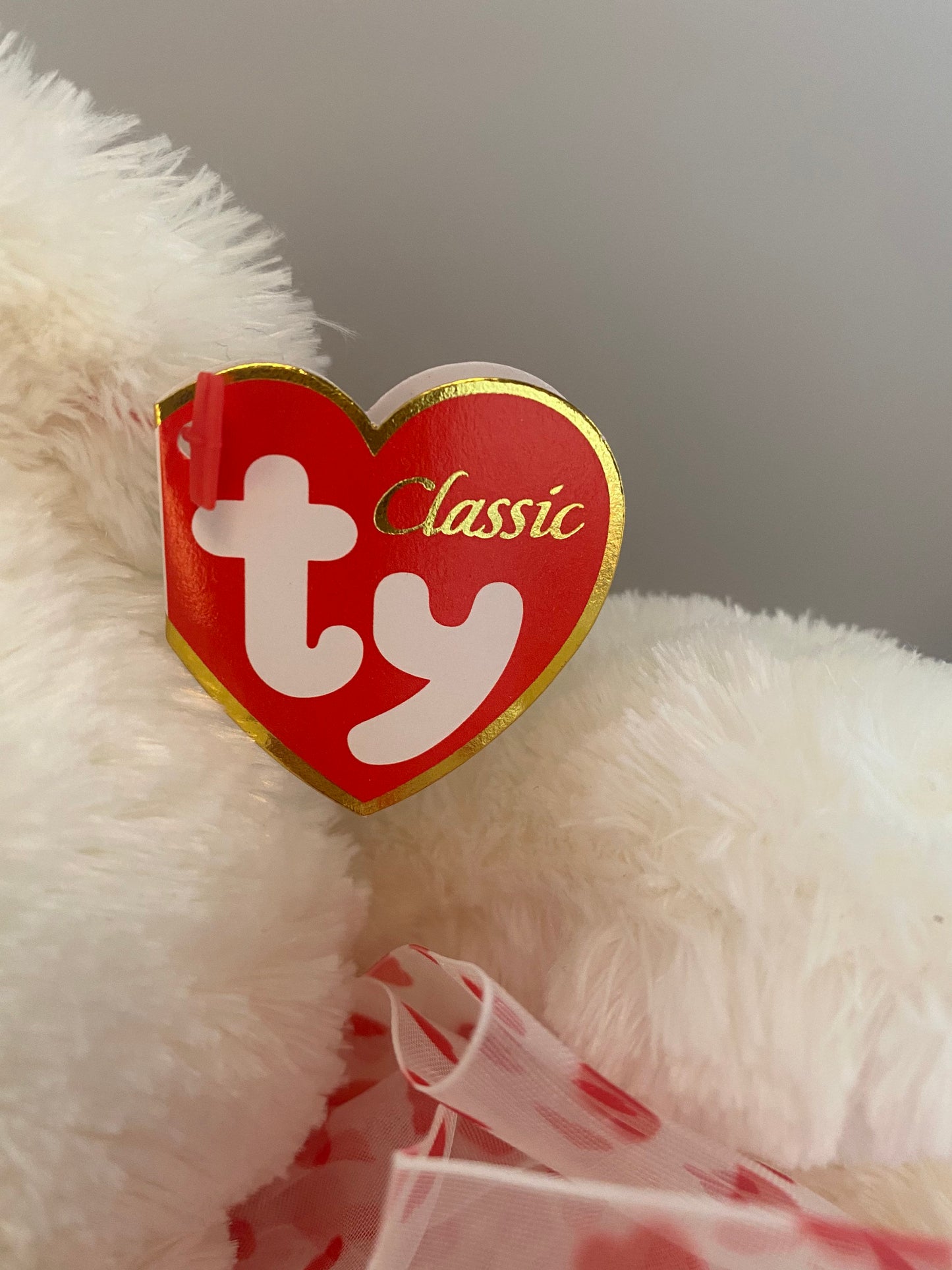 Ty Classics Collection “Caressa” the Bear  with Hearts on Feet and  Ribbon Bow around Neck (11 inch)