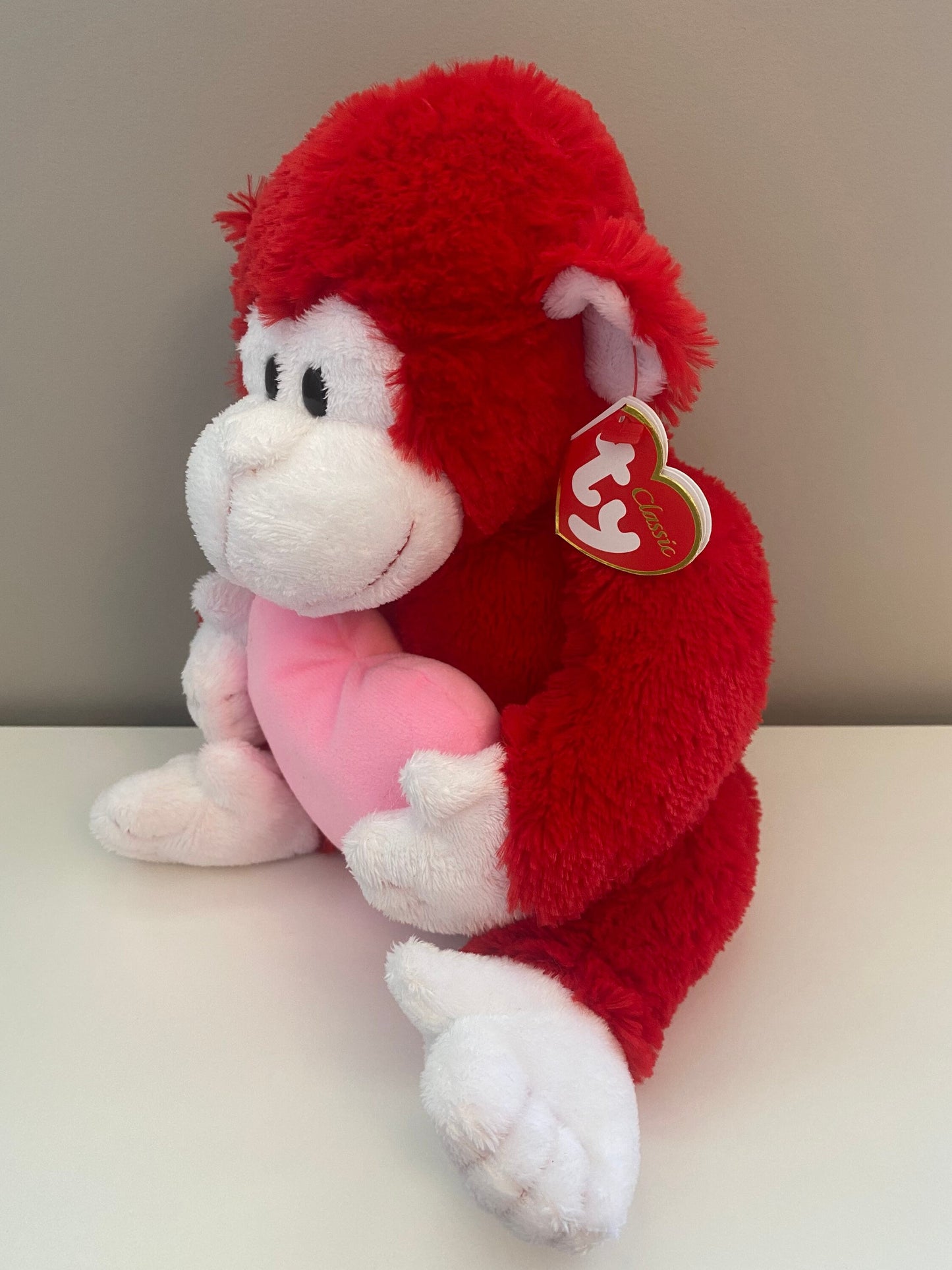 Ty Classics Collection “Dynamite” the Red Monkey Holding a Pink Heart (12 inch)