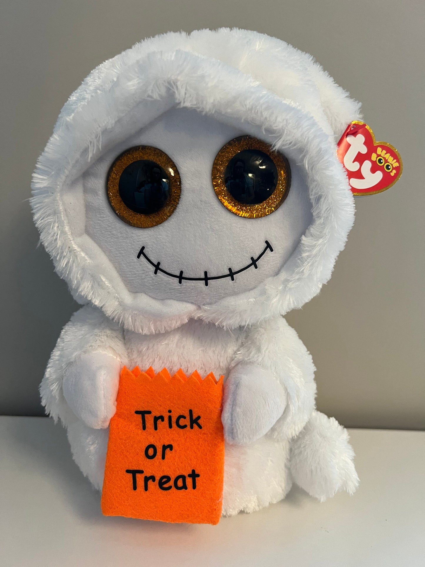 Ty Beanie Boo “Mist” the Ghost holding Trick or Treat Bag - Glitter Eyes - Medium Size (9 inch)