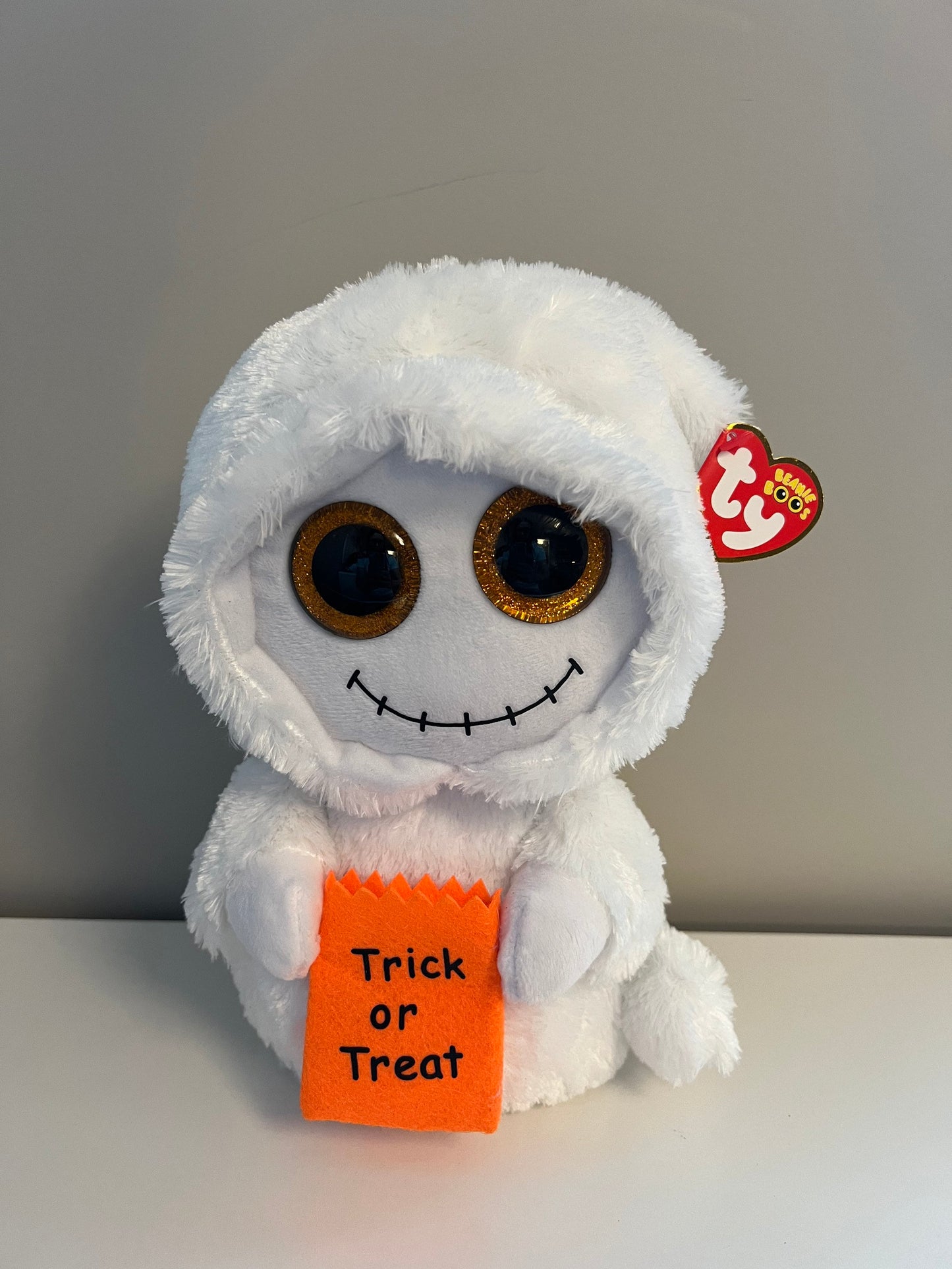 Ty Beanie Boo “Mist” the Ghost holding Trick or Treat Bag - Glitter Eyes - Medium Size (9 inch)