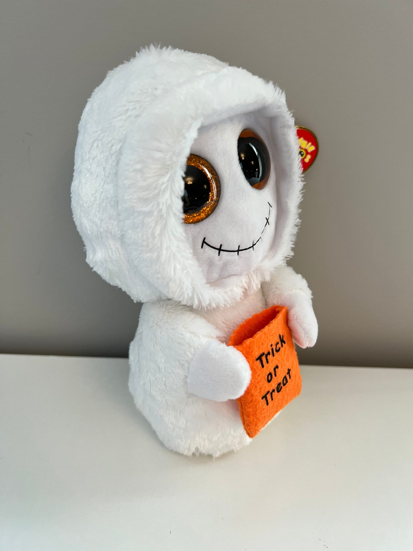 Ty Beanie Boo “Mist” the Ghost with Orange Glitter Eyes Holding Trick or Treat Bag *Rare* (6 inch)