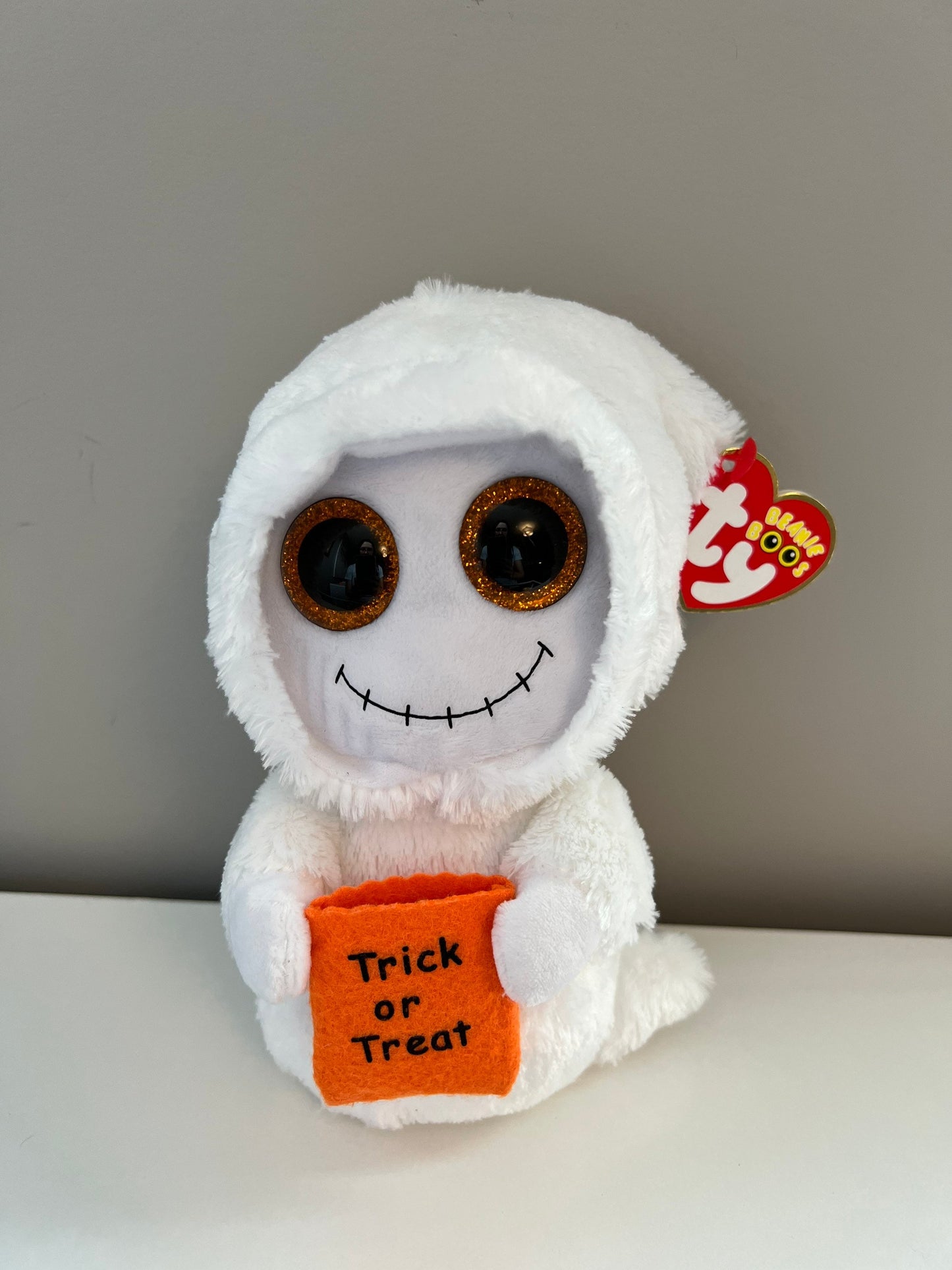 Ty Beanie Boo “Mist” the Ghost with Orange Glitter Eyes Holding Trick or Treat Bag *Rare* (6 inch)