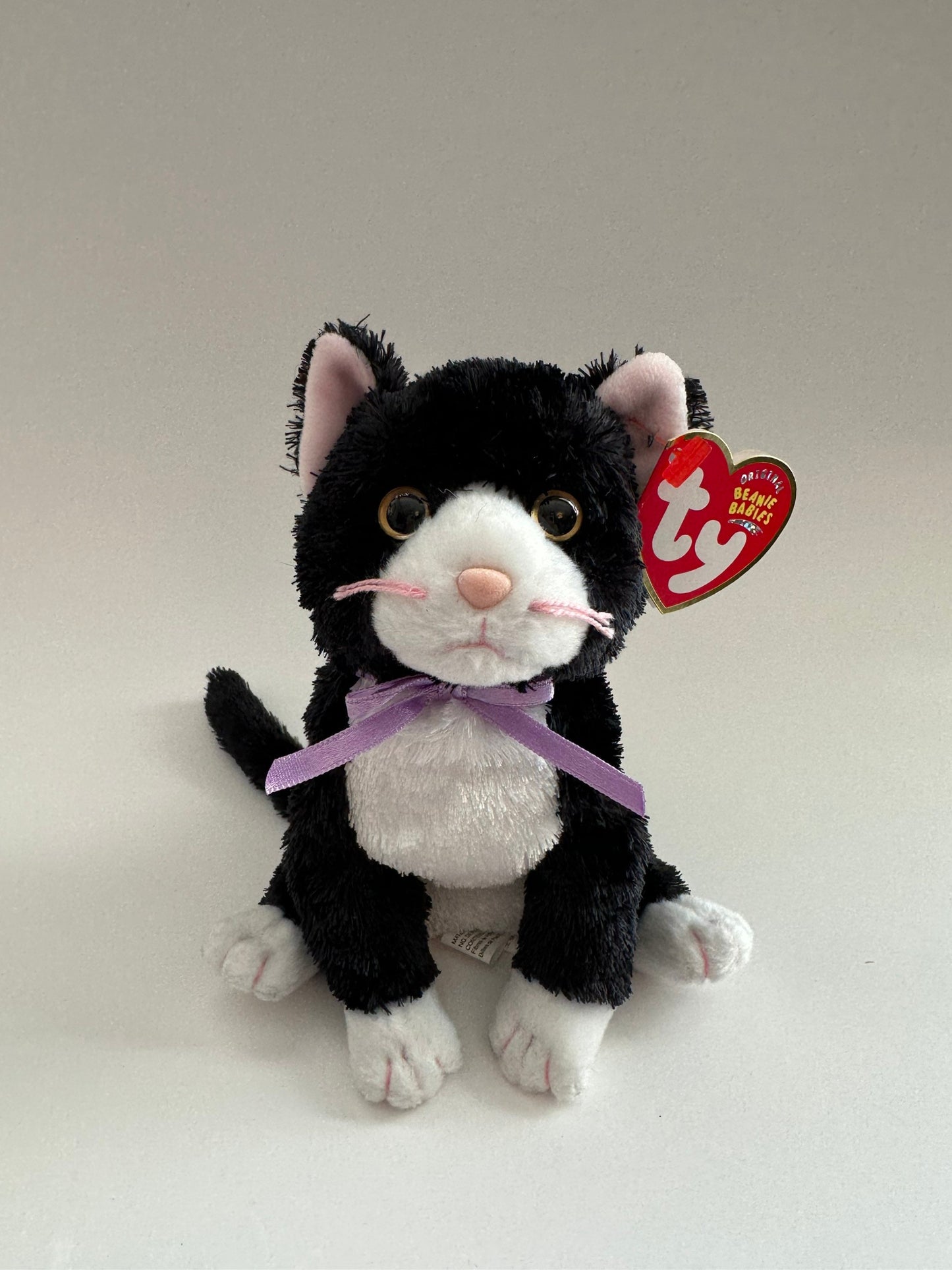 Ty Beanie Baby “Fussy” the Black and White Cat wearing a Purple Bow! (8 inch)