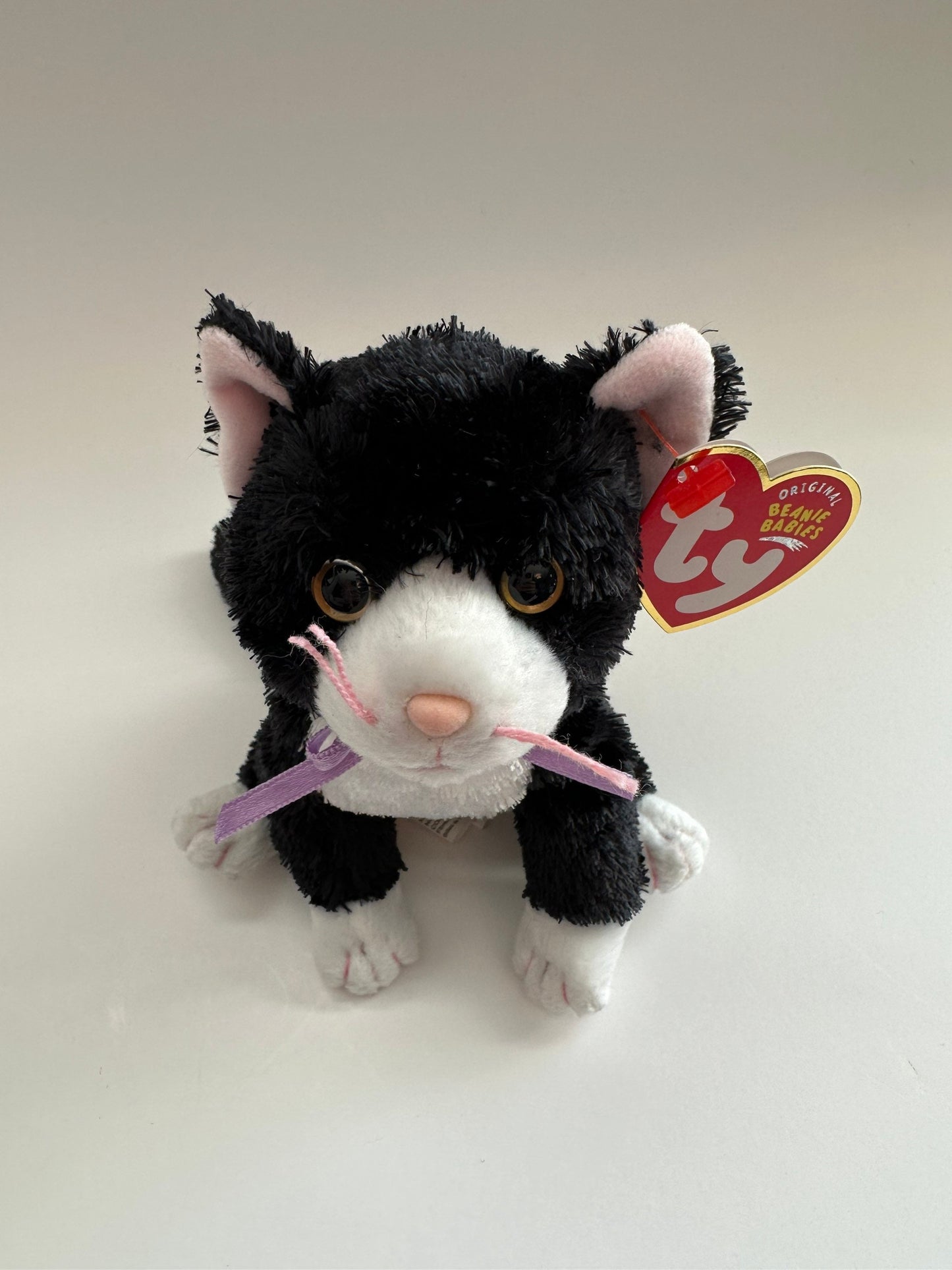 Ty Beanie Baby “Fussy” the Black and White Cat wearing a Purple Bow! (8 inch)