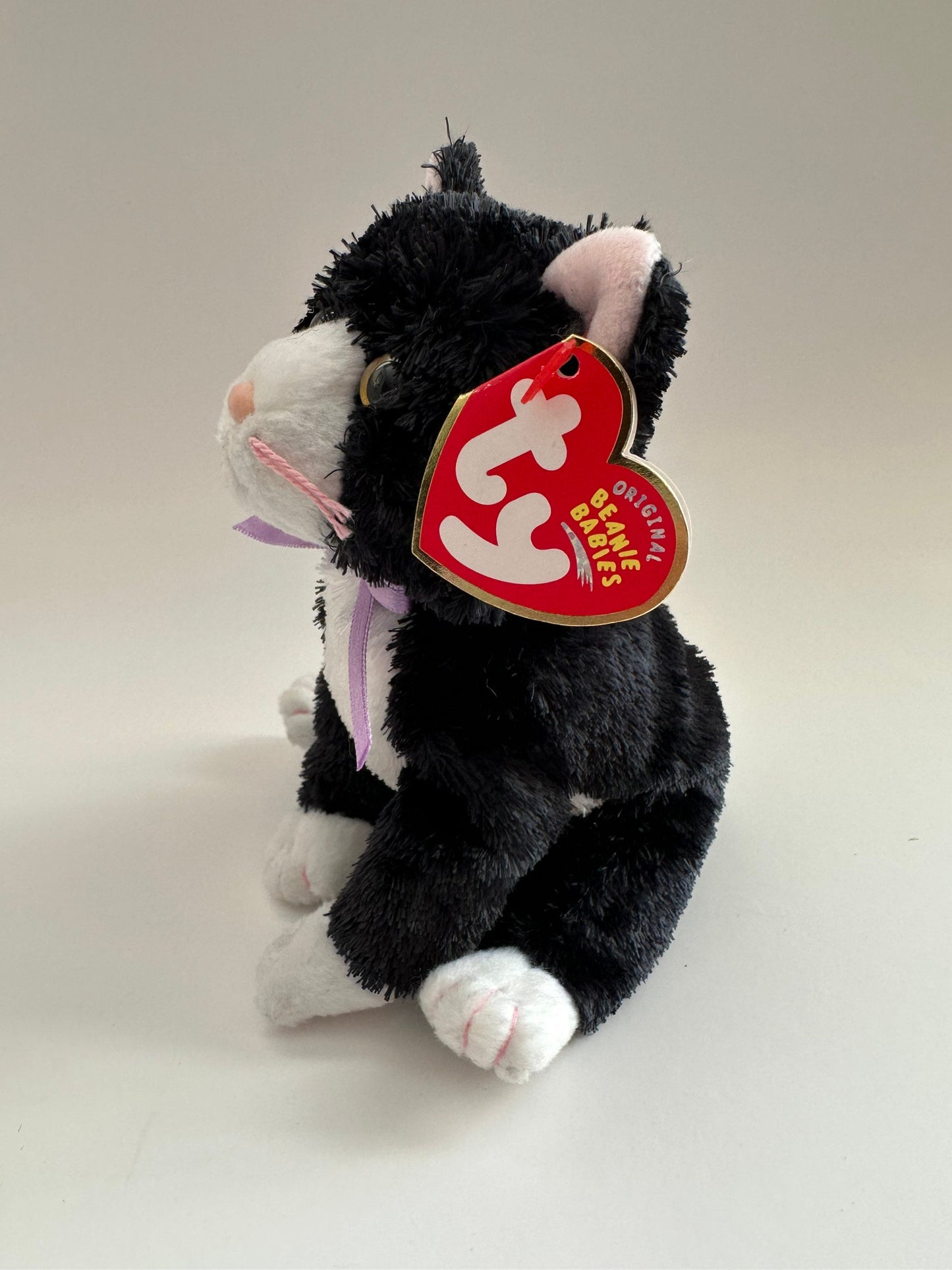 Ty Beanie Baby “Fussy” the Black and White Cat wearing a Purple Bow! (8 inch)