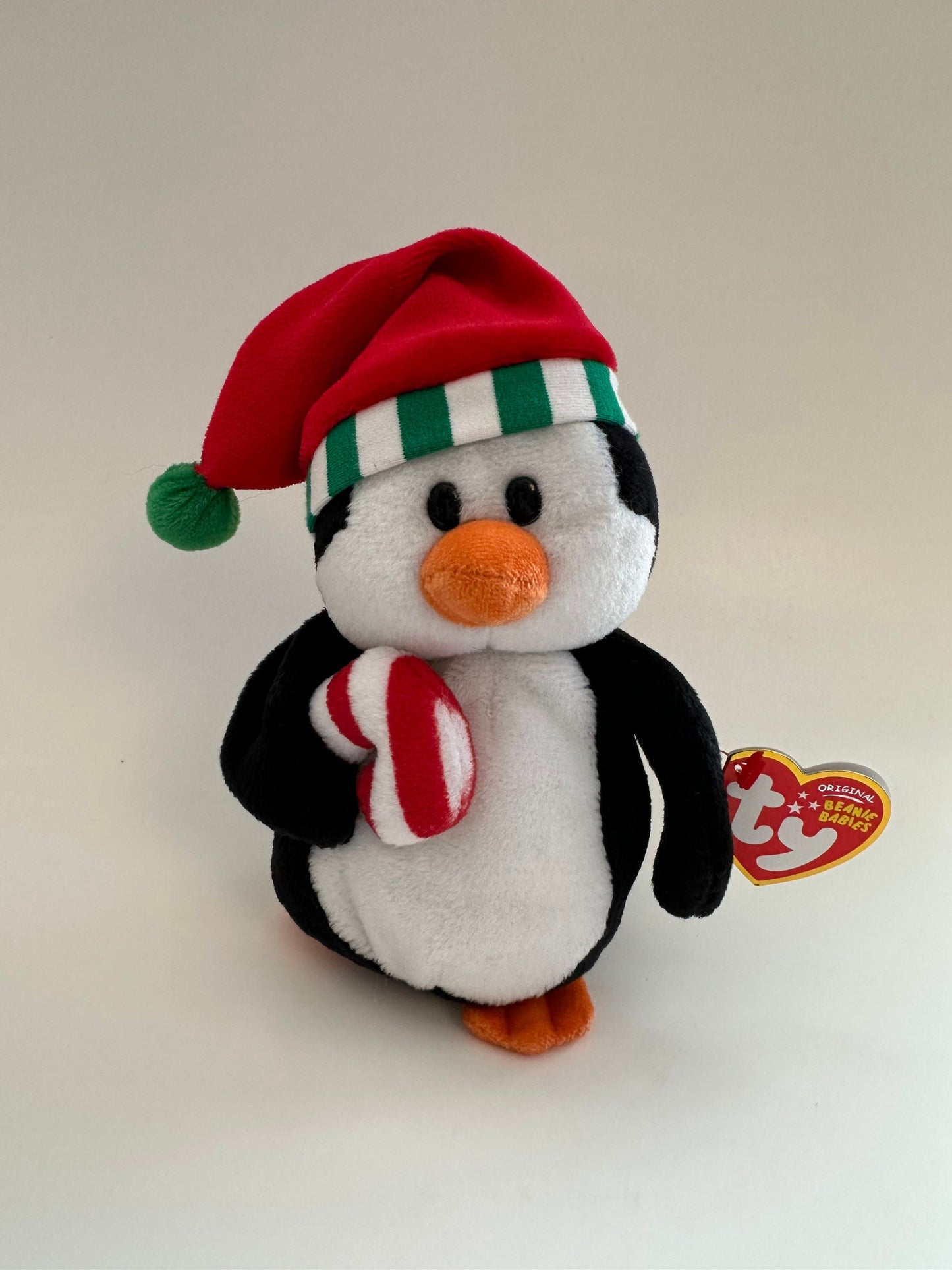 Ty Beanie Baby “Sweetest” the Holiday Penguin wearing Santa Hat holding Candy Cane (7 inch)