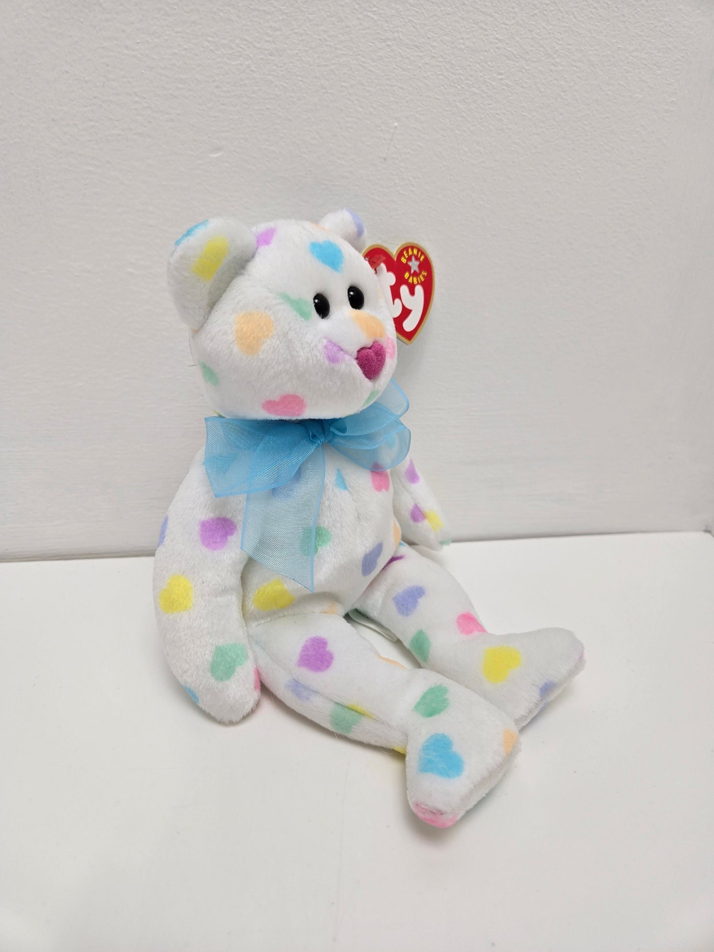 Ty Beanie Baby “Kiss me” the Bear  with multi coloured hearts (8.5 inch)