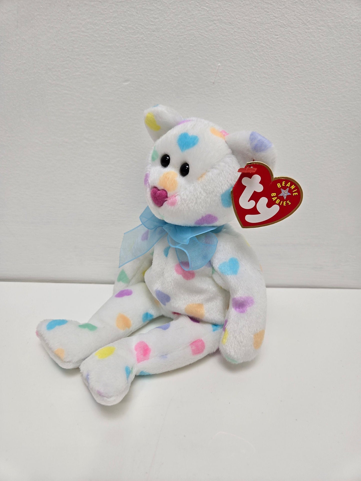 Ty Beanie Baby “Kiss me” the Bear  with multi coloured hearts (8.5 inch)