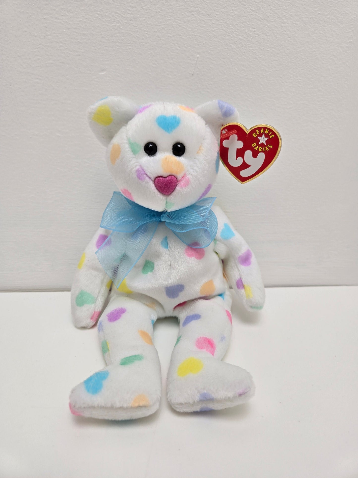 Ty Beanie Baby “Kiss me” the Bear  with multi coloured hearts (8.5 inch)