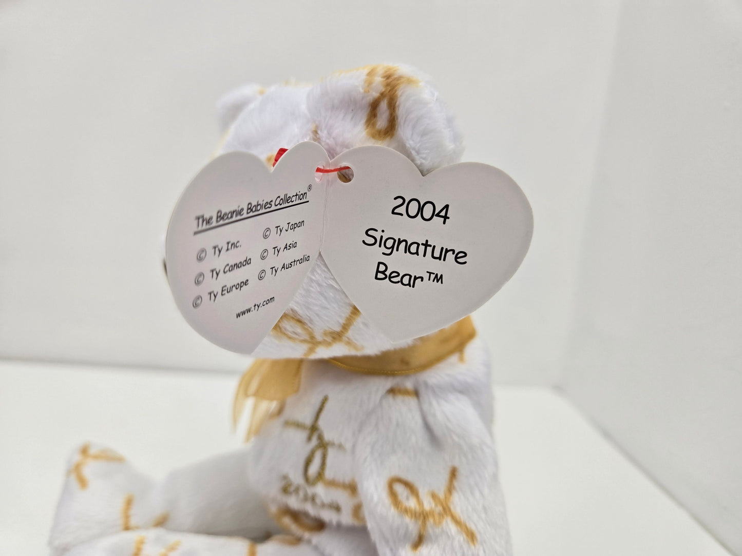 Ty Beanie Baby “2004 Signature Bear” Gold and White Bear (8.5 inch)