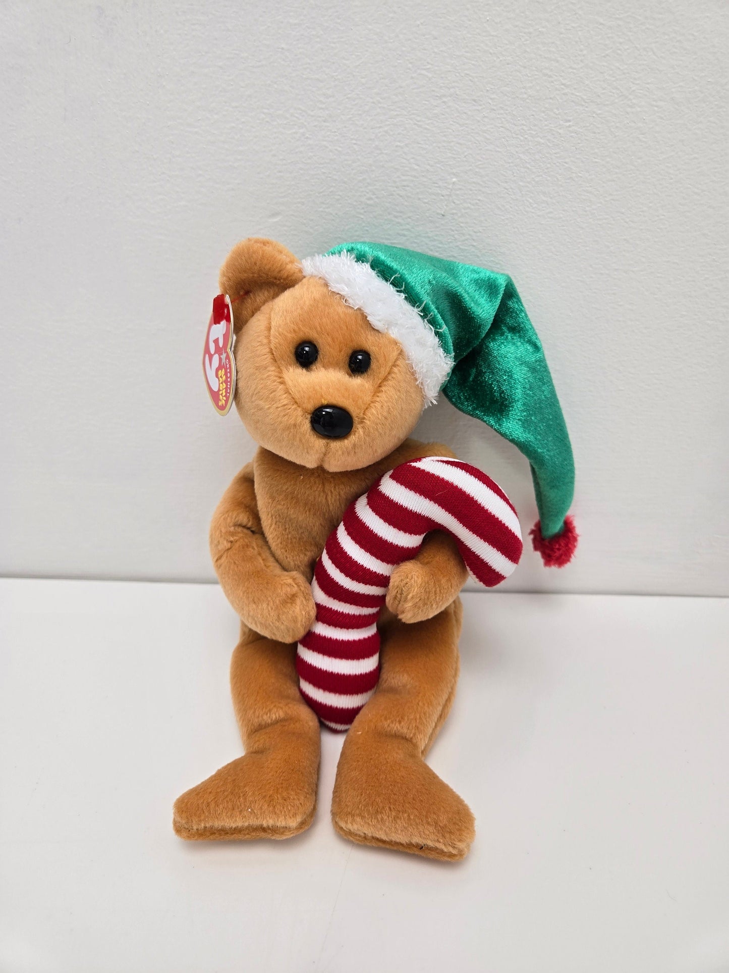 Ty Beanie Baby “Tasty” the Christmas Holiday Bear holding a Candy Cane and wearing a Green Hat! (9 inch)